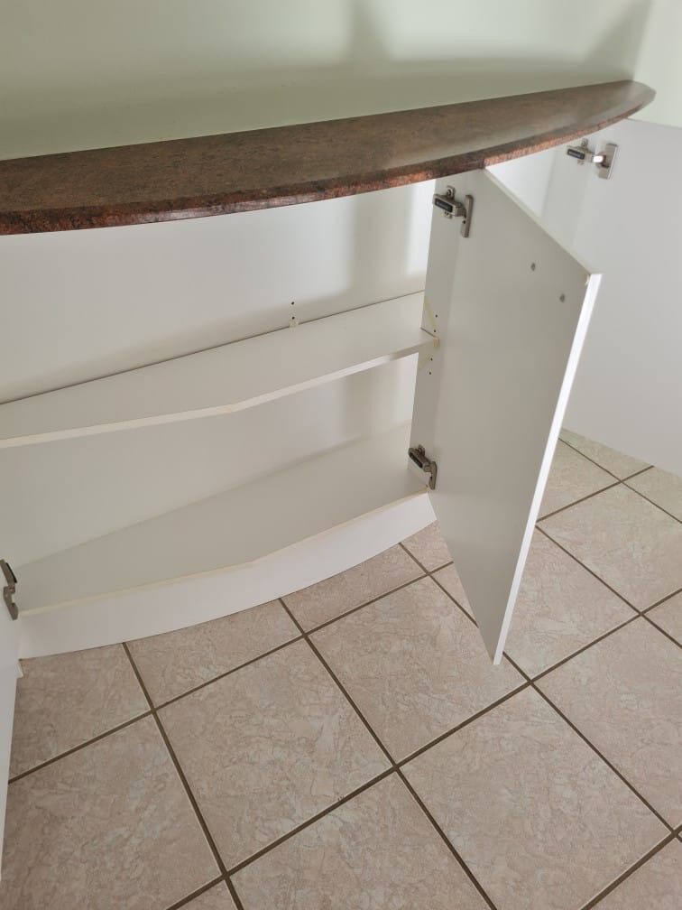 Kitchen cupboard interiors cleaned out for house sale handover