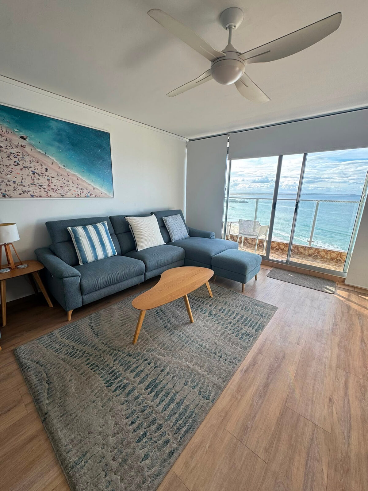Coastal living room cleaned and styled for holiday guests