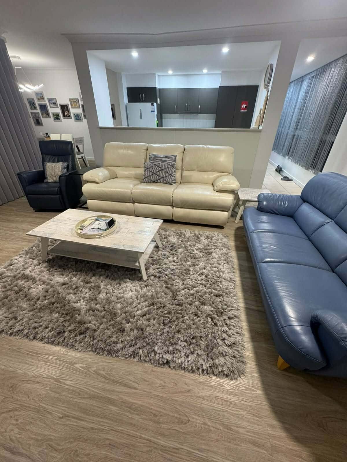 Open plan living and dining area tidied and vacuumed during a home clean