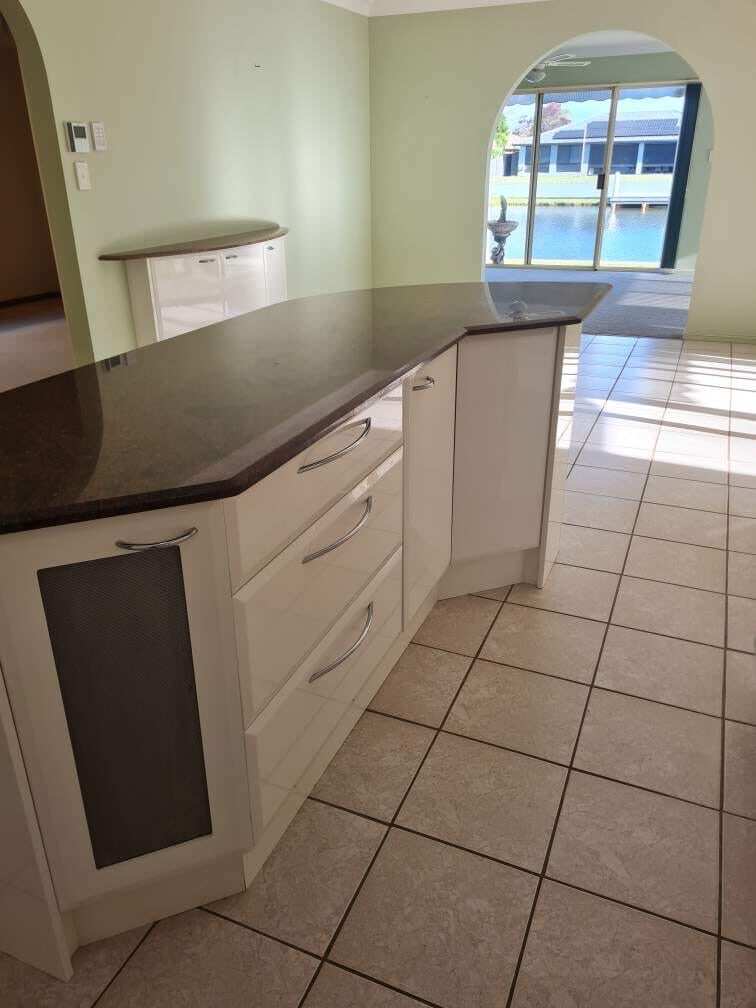 Kitchen island and tiled floors cleaned before the new owners move in