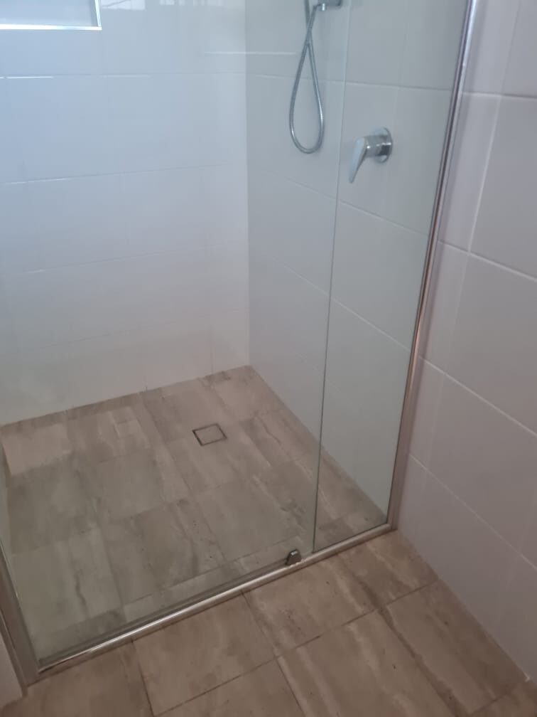 Shower screen, tiles and floor waste cleaned for house sale handover