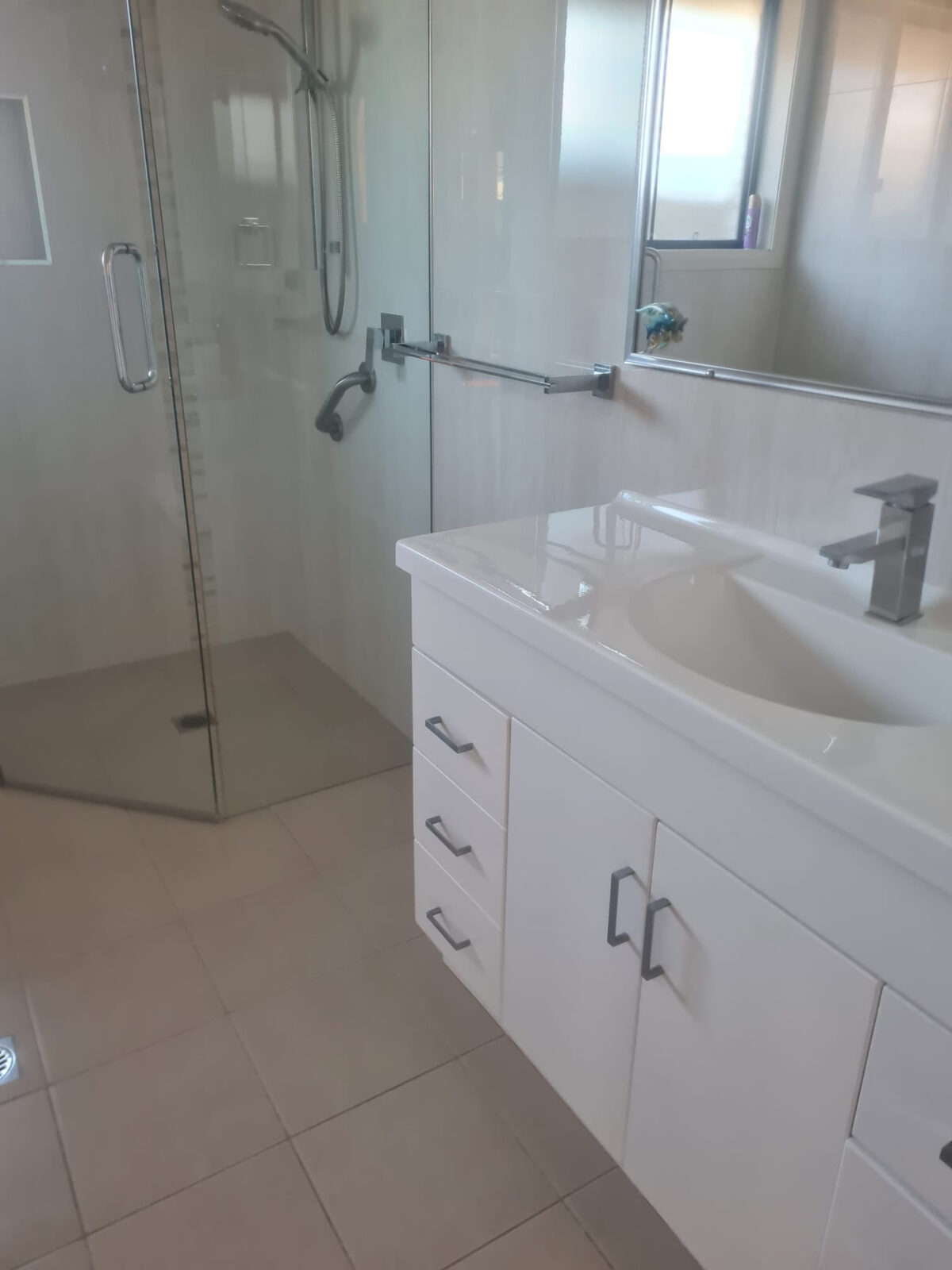 Bathroom vanity, mirror and shower screen cleaned for vacate inspection