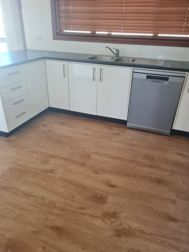 Kitchen benches, sink and dishwasher cleaned for house sale handover