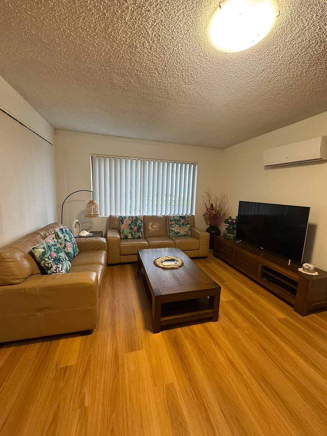 Tidy lounge room cleaned during a regular home clean in Forster